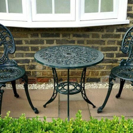 a table and chairs outside a house