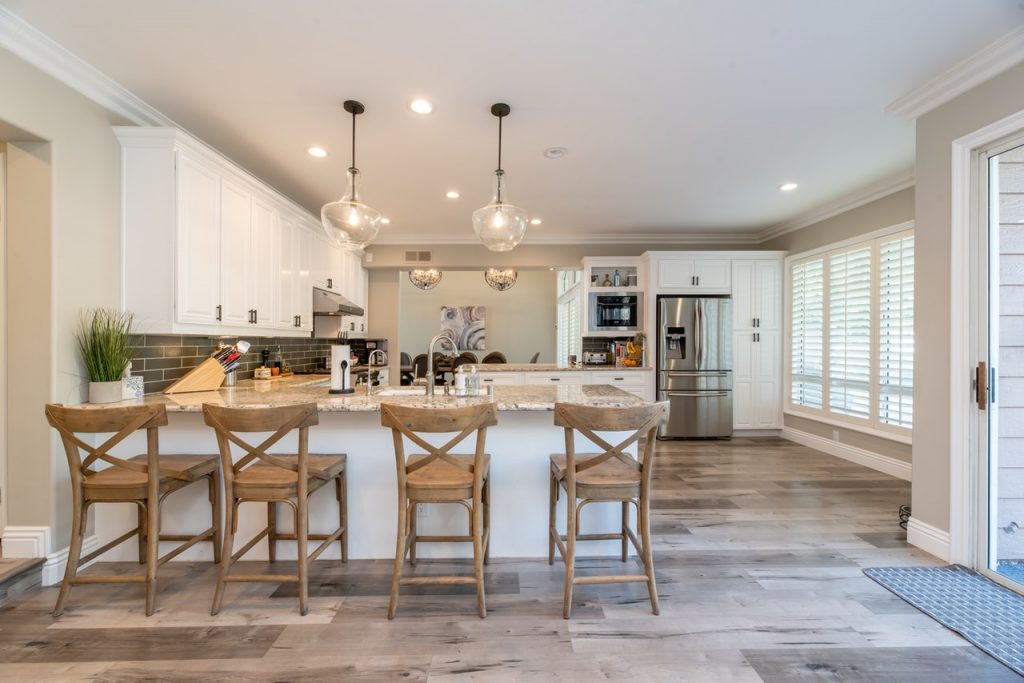 a kitchen with a table and chairs