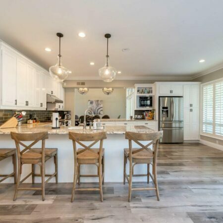 a kitchen with a table and chairs