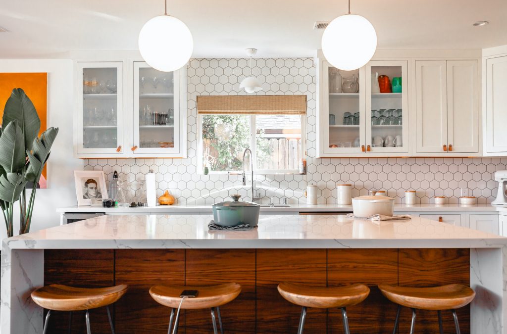 a kitchen with white cabinets