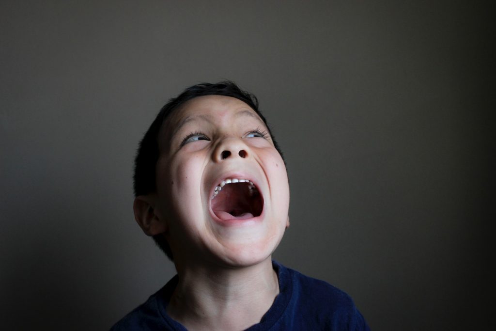 a boy with his mouth open