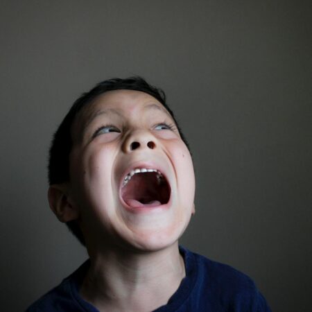 a boy with his mouth open