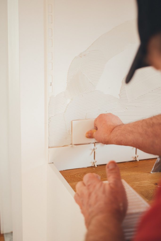 a person drawing on a white board