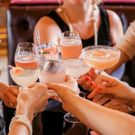 a group of people holding drinks