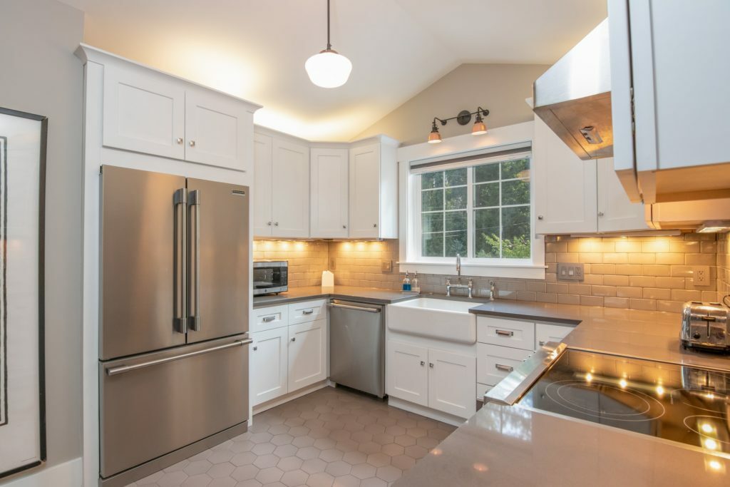 a kitchen with white cabinets