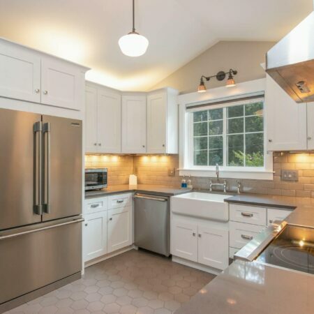 a kitchen with white cabinets