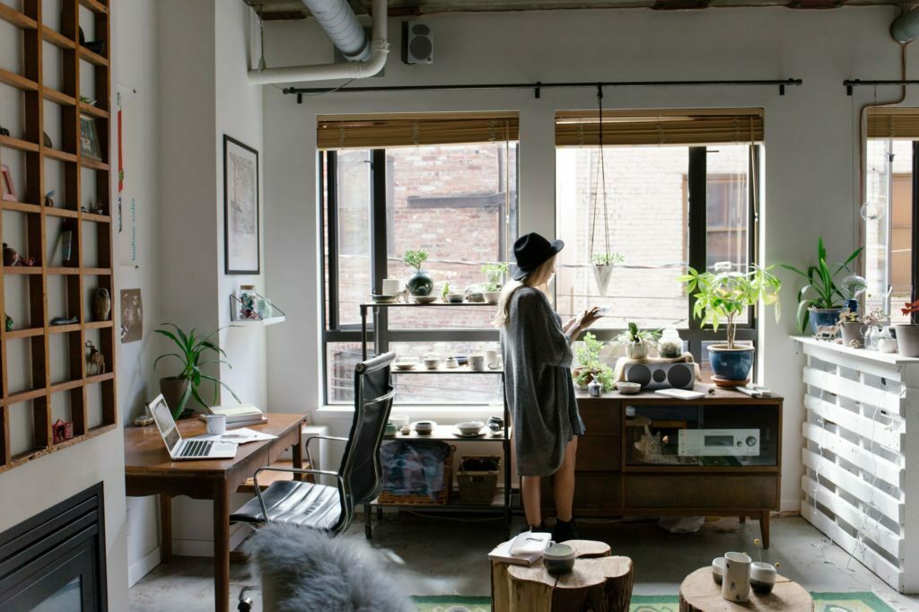 a person standing in a cluttered room