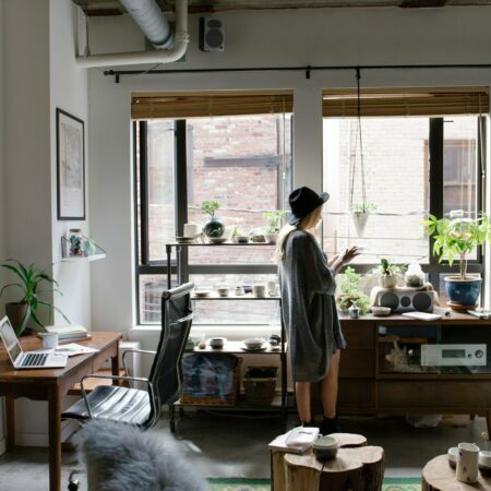 a person standing in a cluttered room