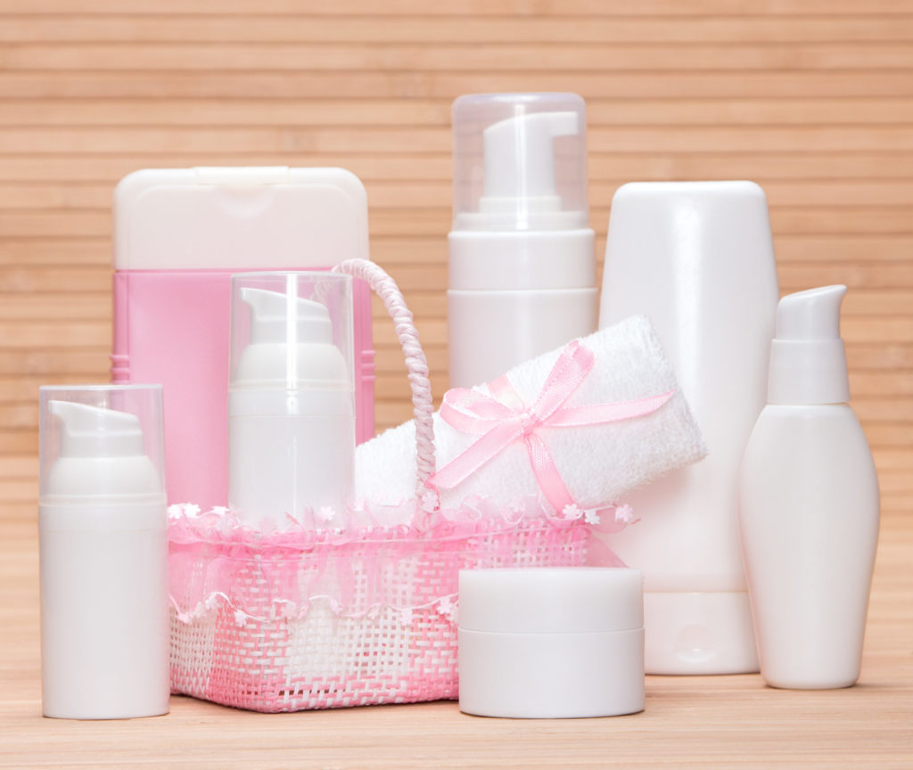 a group of pink and white containers