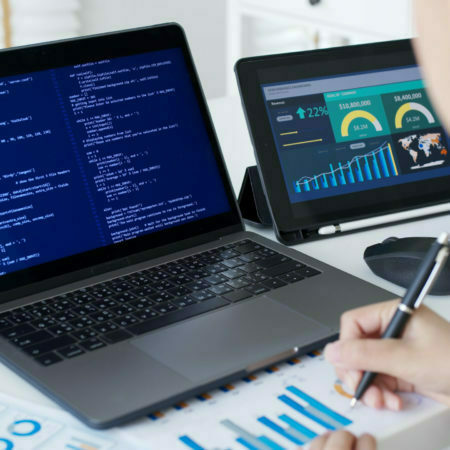 Back rear view of young asian woman, freelance data scientist work remotely at home coding